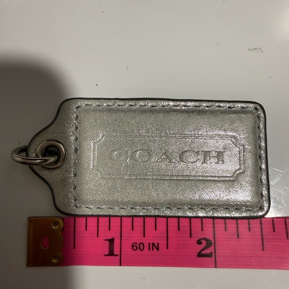 Coach metallic gray light hangtag 2.5 in